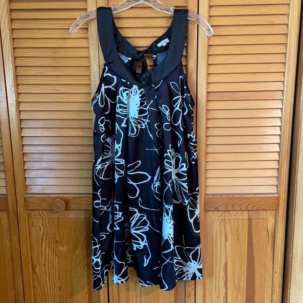 Black Trapeze dress with floral print.